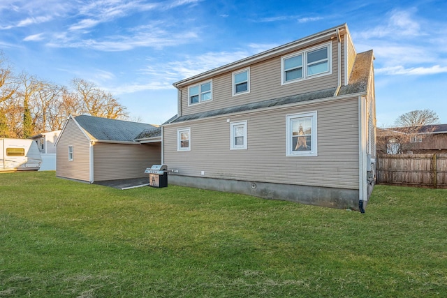 back of house with a yard