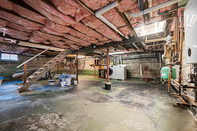 basement featuring washing machine and clothes dryer