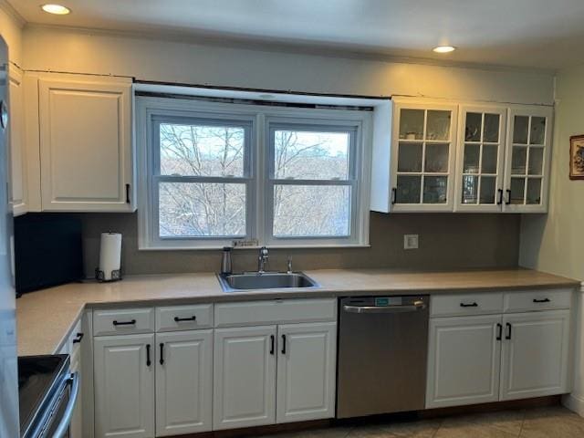 kitchen with white cabinetry, sink, and dishwasher