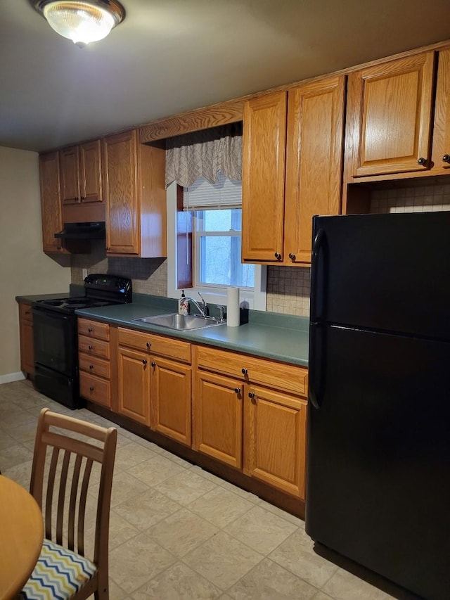 kitchen featuring tasteful backsplash, sink, and black appliances