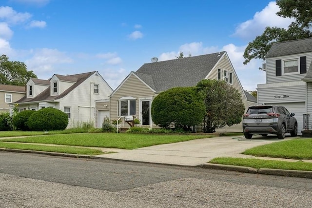 view of front of home with a garage and a front yard