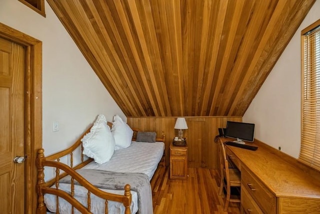 interior space with wood-type flooring, vaulted ceiling, and wood ceiling