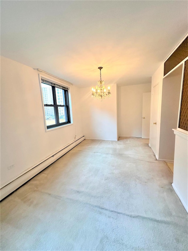 carpeted spare room featuring a chandelier and baseboard heating