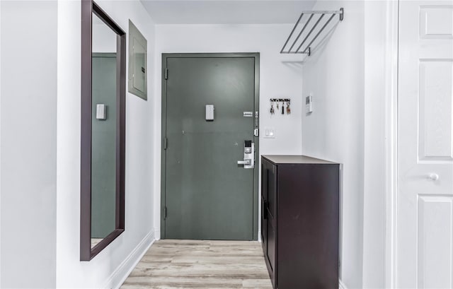 entryway with electric panel and light wood-type flooring