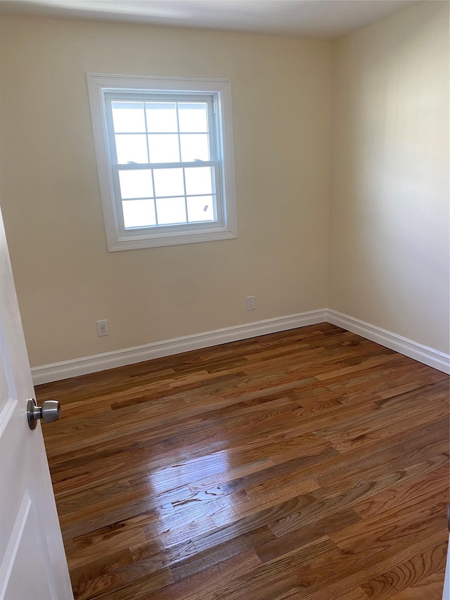 empty room featuring dark hardwood / wood-style floors