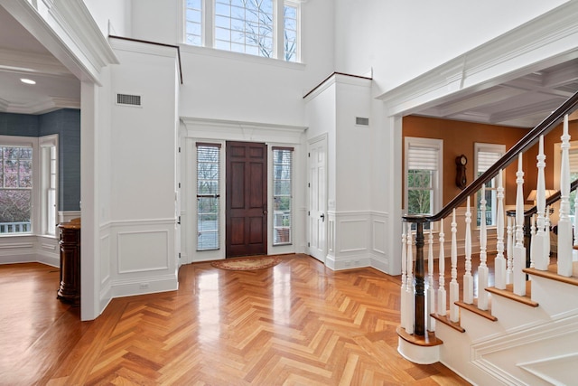 entryway with light parquet flooring