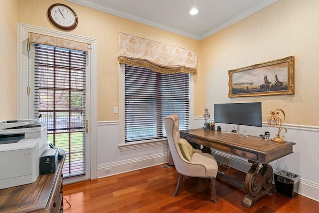 office area with hardwood / wood-style flooring, a wealth of natural light, and ornamental molding