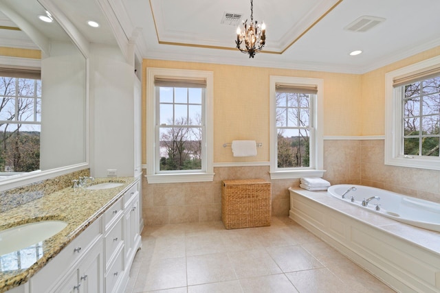 bathroom featuring vanity, crown molding, and plenty of natural light