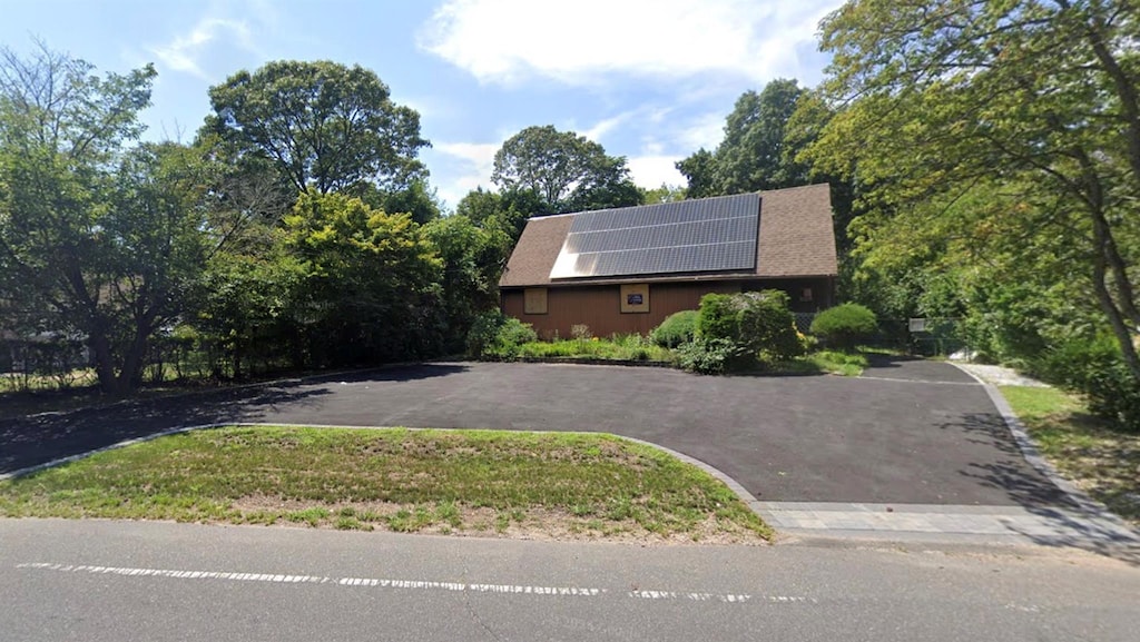 view of front facade with solar panels