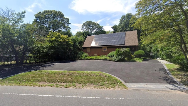 view of front facade with solar panels