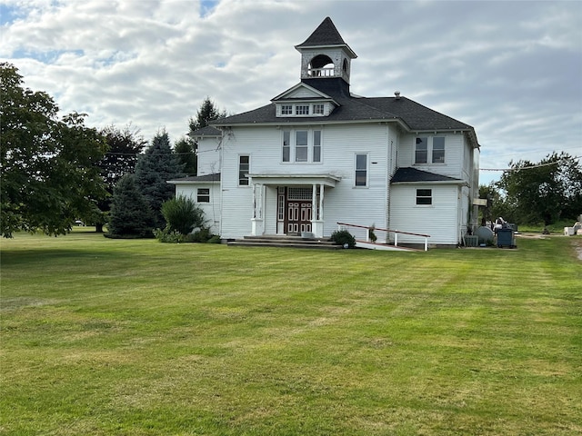 back of property with a yard