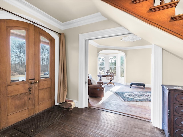 entryway with ornamental molding, dark wood finished floors, and baseboards