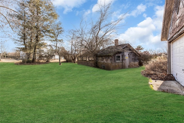 view of yard featuring a garage