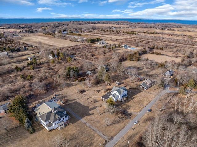 aerial view with a water view and a rural view