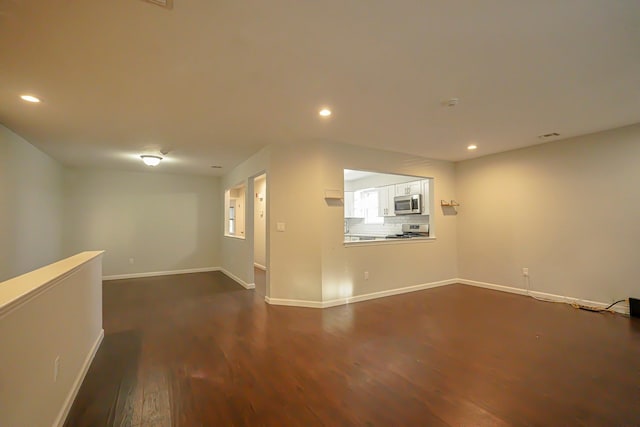 interior space with dark hardwood / wood-style floors