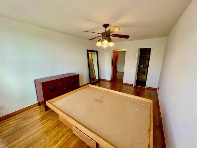 unfurnished bedroom with hardwood / wood-style flooring and ceiling fan