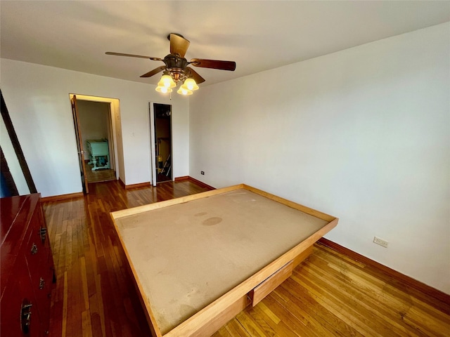 bedroom featuring dark wood-type flooring and ceiling fan