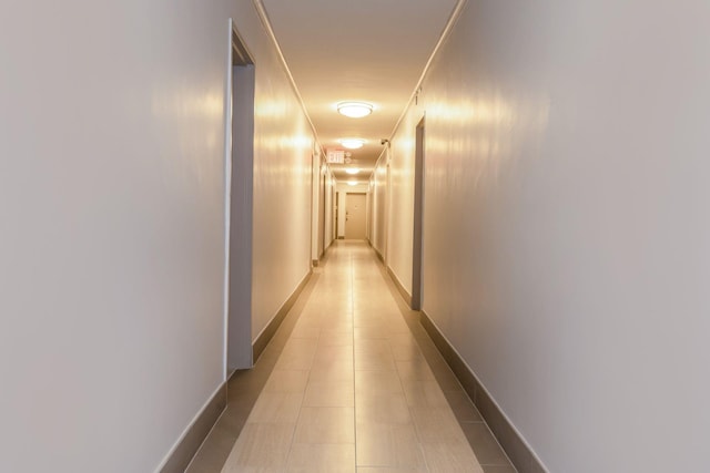 corridor featuring light tile patterned flooring