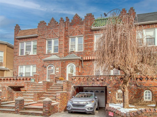 multi unit property featuring a garage