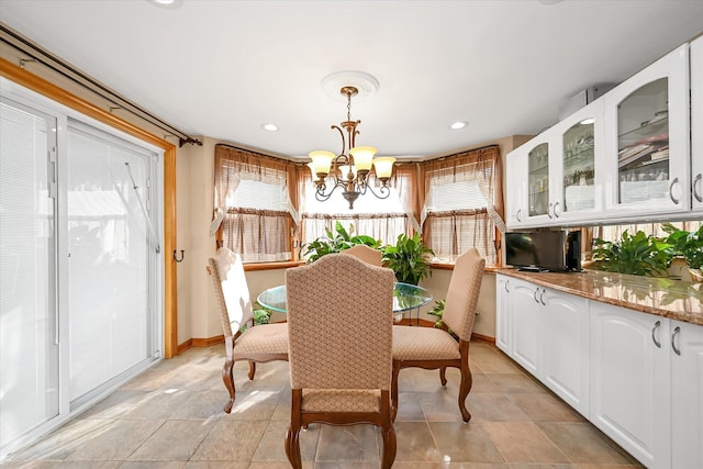 dining area featuring an inviting chandelier