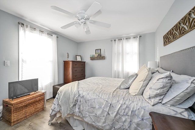 bedroom featuring light wood-type flooring and ceiling fan