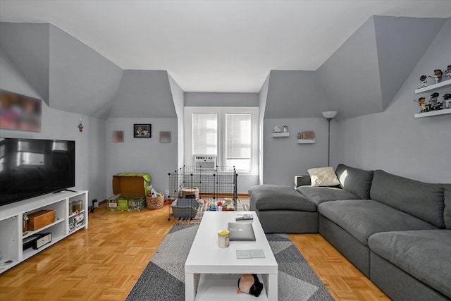 living room featuring vaulted ceiling and light parquet floors