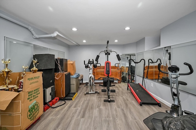 exercise area with light hardwood / wood-style floors