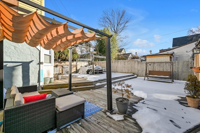 snow covered deck with a pergola and outdoor lounge area