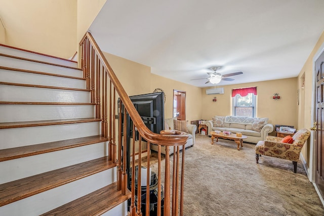 carpeted living room featuring a wall mounted AC and ceiling fan