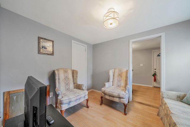 sitting room with hardwood / wood-style floors