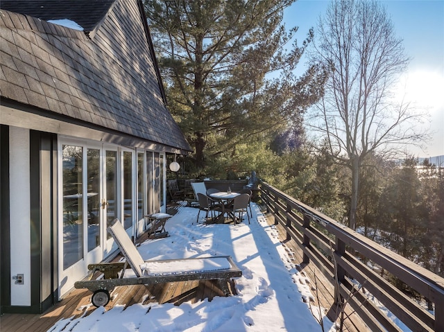 view of snow covered deck