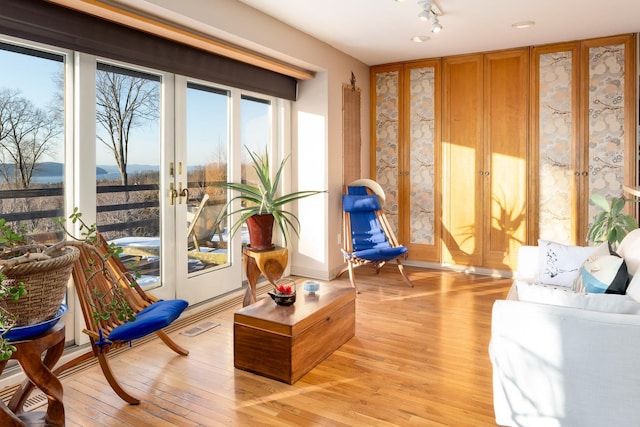 sitting room with light hardwood / wood-style floors