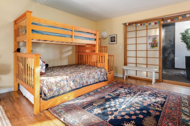 bedroom with hardwood / wood-style flooring