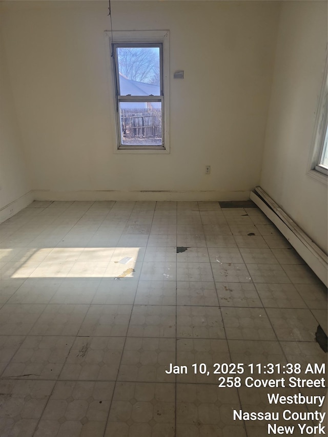 spare room featuring a baseboard radiator