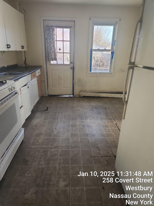 kitchen featuring white cabinetry, white appliances, sink, and a baseboard heating unit