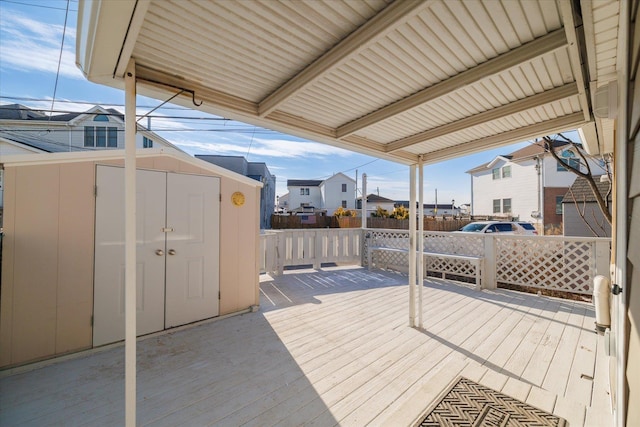 deck featuring a shed