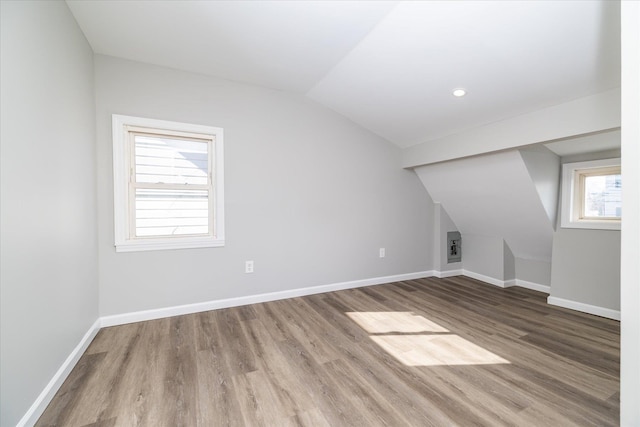 bonus room featuring lofted ceiling and hardwood / wood-style flooring