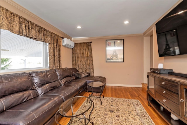 living room with crown molding, light hardwood / wood-style floors, and an AC wall unit