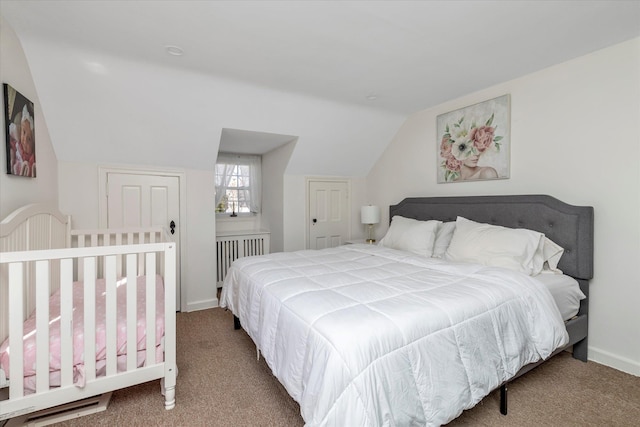 carpeted bedroom with vaulted ceiling