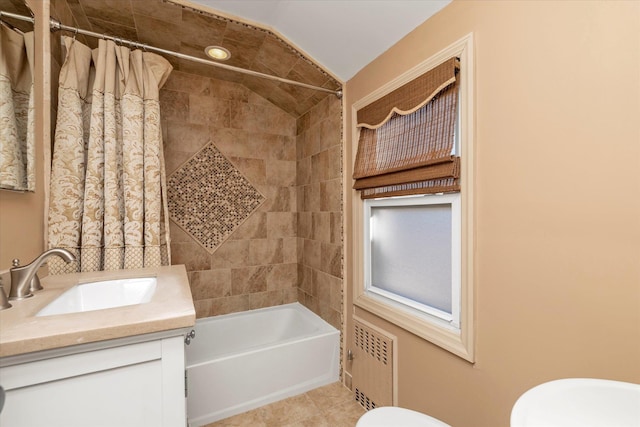 full bathroom featuring lofted ceiling, shower / bath combo, radiator heating unit, vanity, and toilet