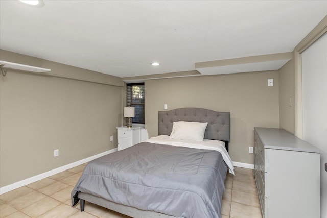 bedroom with light tile patterned floors