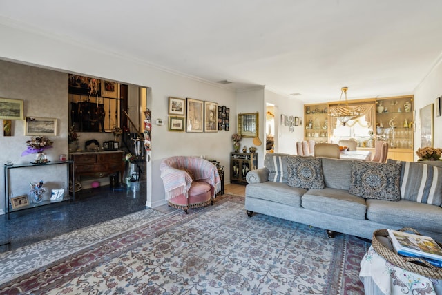 living room featuring ornamental molding, visible vents, and baseboards