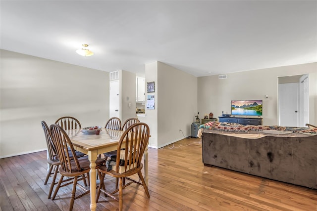 dining room featuring light hardwood / wood-style flooring