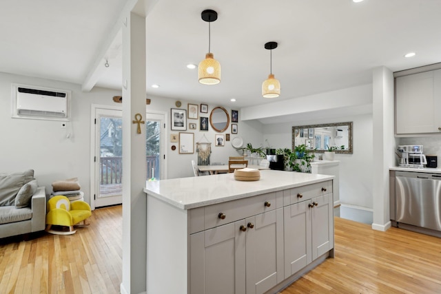 kitchen featuring light stone counters, a wall mounted air conditioner, dishwasher, and light wood-type flooring