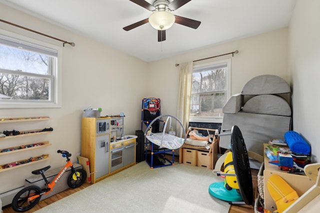 playroom featuring plenty of natural light and ceiling fan