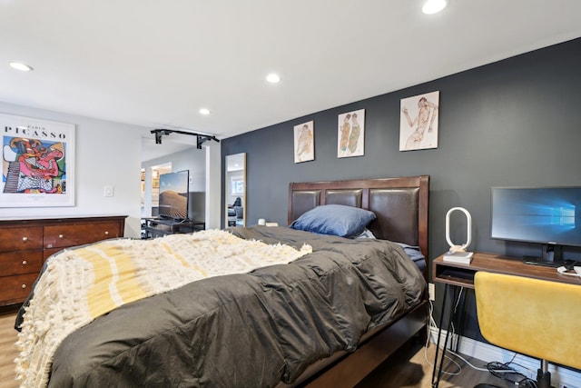 bedroom with hardwood / wood-style floors