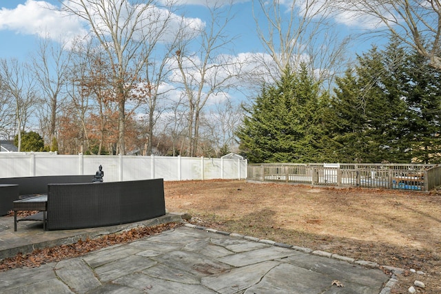 view of yard with an outdoor living space and a patio