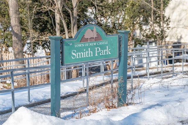 community / neighborhood sign with fence