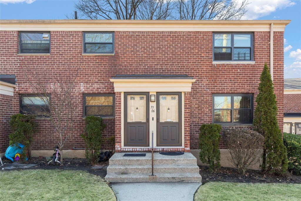 73-06 Springfield Blvd Upper, Upper, Bayside, NY 11364 - view of front of house with brick siding