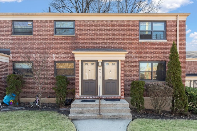 view of front of house with brick siding